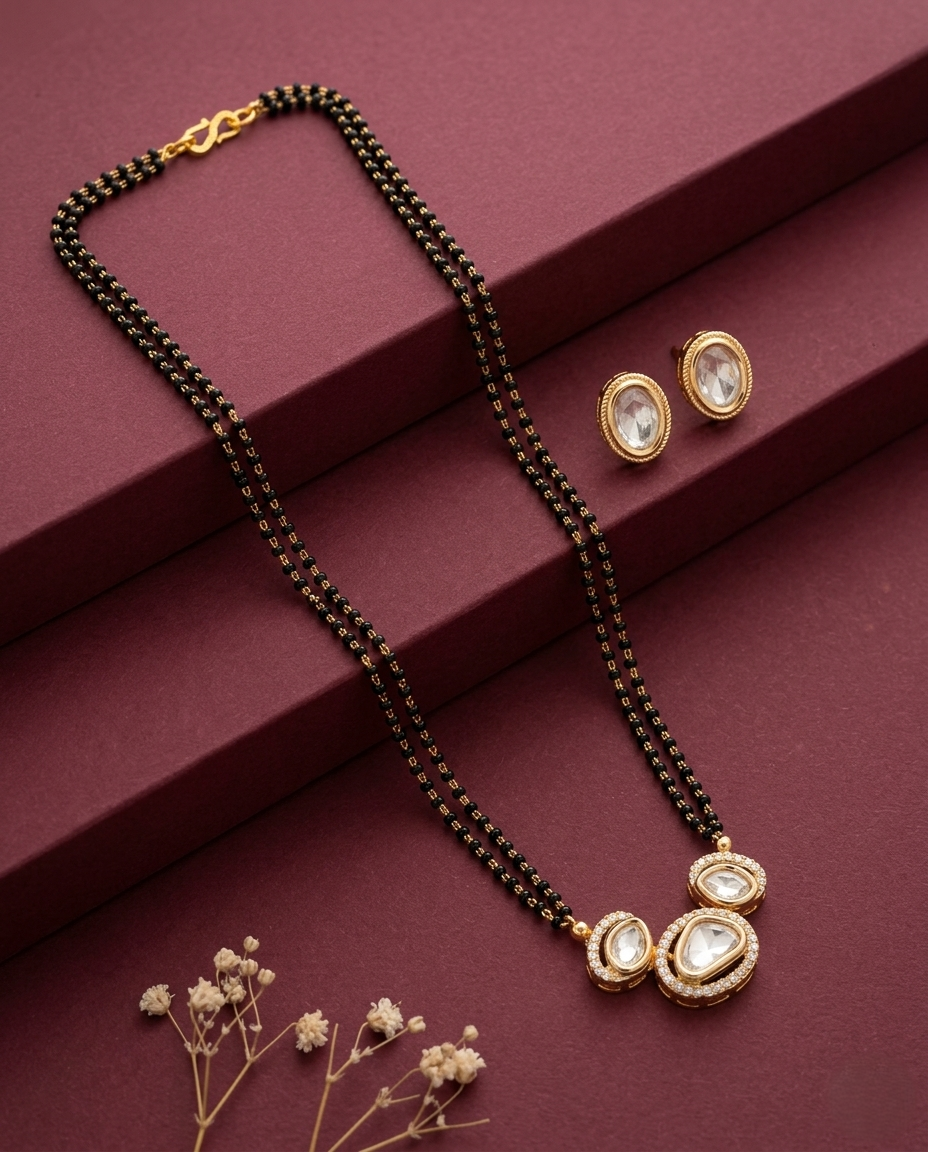 Jewelry set with necklace and earrings on a maroon surface