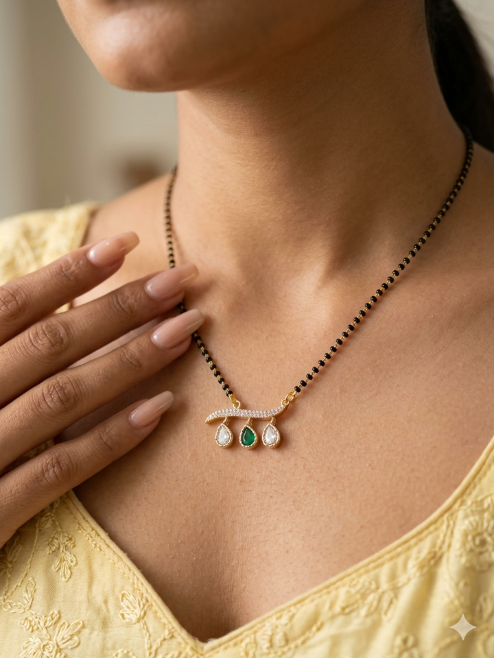 Necklace with a pendant worn by a person in a yellow top
