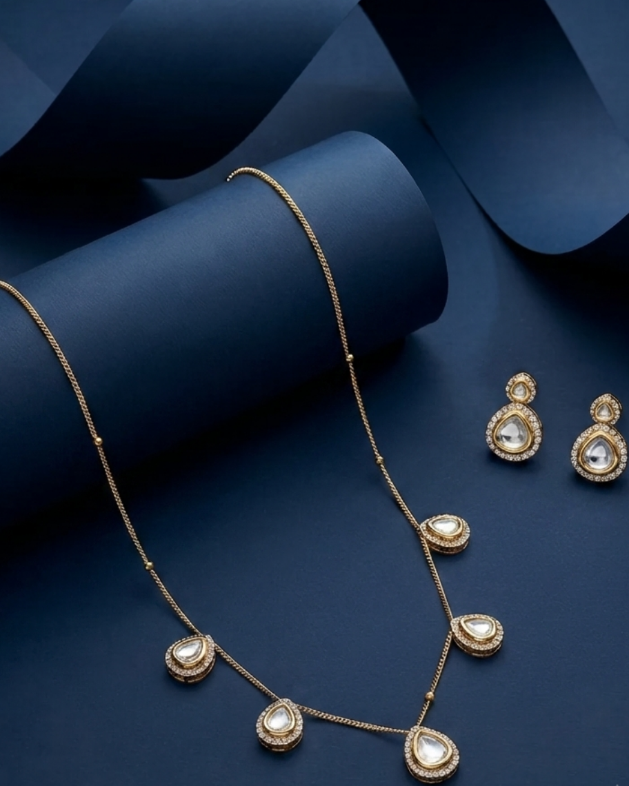 The Noor Kundan Charm Necklace Set is designed for women who appreciate understated elegance