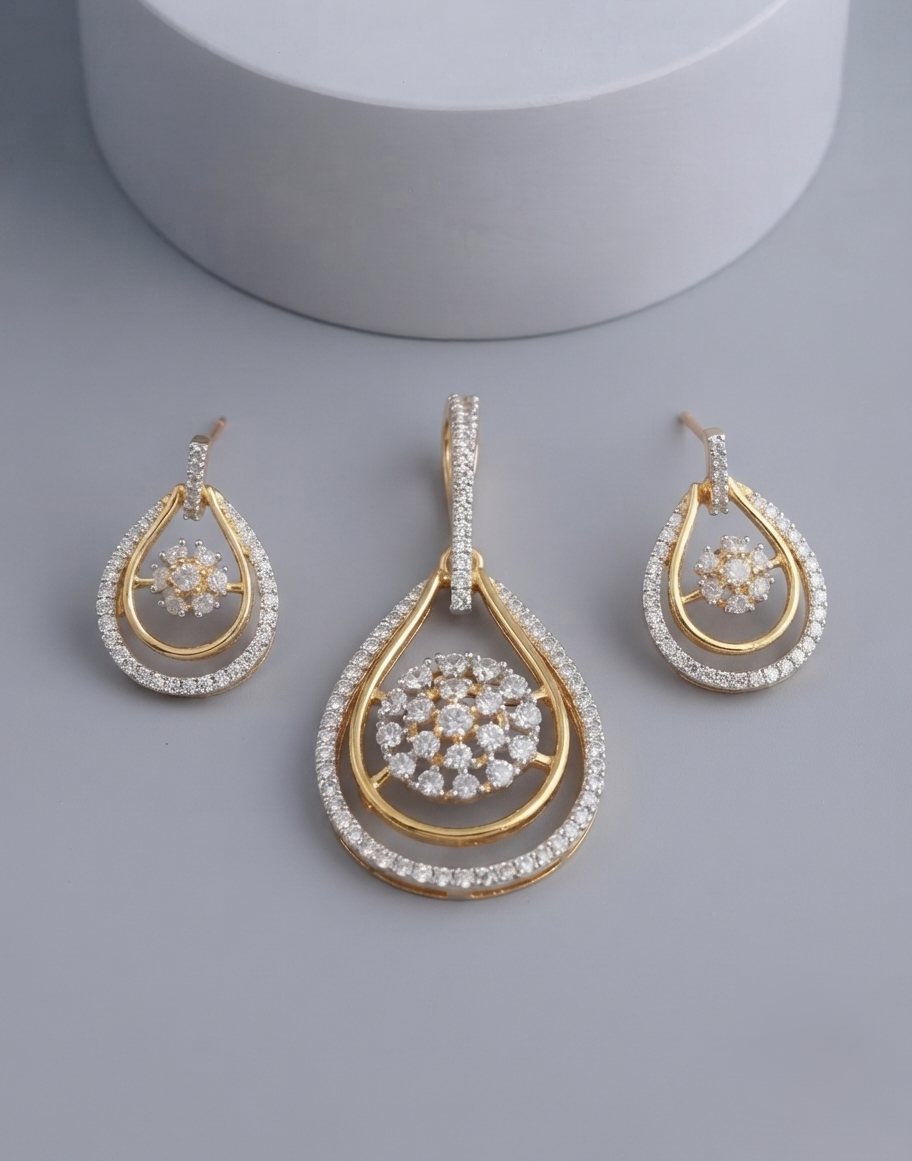 Shop the Noor Teardrop Elegance Pendant Set with secure screw-back earrings.