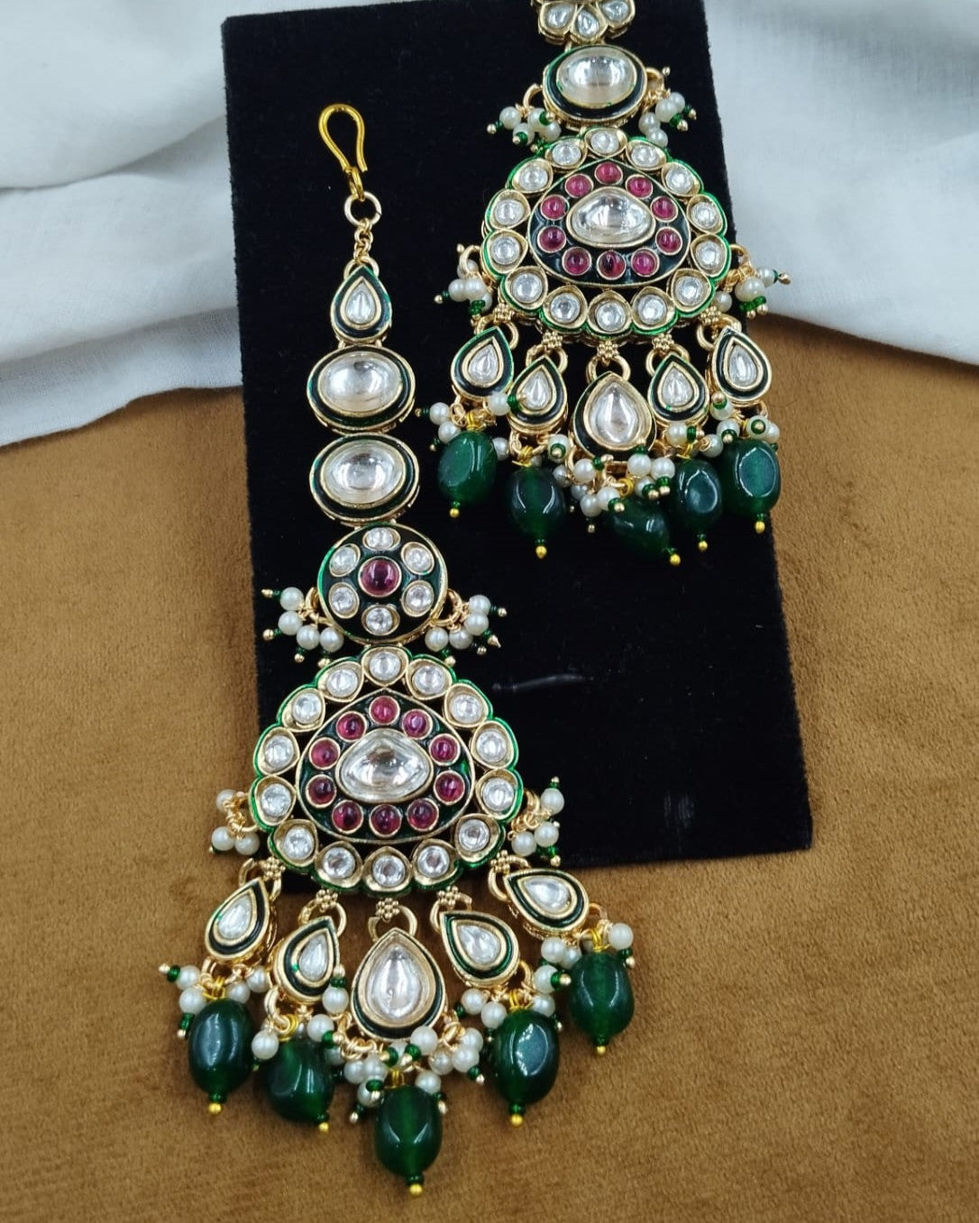 Elegant wedding necklace and earring set highlighted by classic kundan detailing