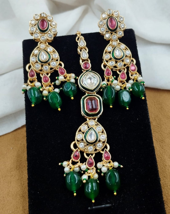 Traditional polki kundan necklace with ruby coloured stones and green bead detailing, ethnic wedding wear set