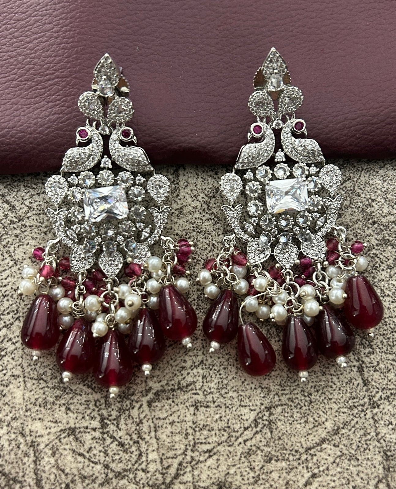 Ornate earrings with red and clear stones diamond 