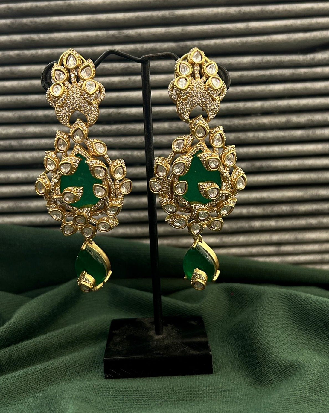 Traditional jewellery ensemble crafted with deep green beads and bold pendant styling
