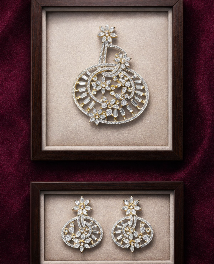 Pair of ornate earrings displayed in wooden frames on a dark red background