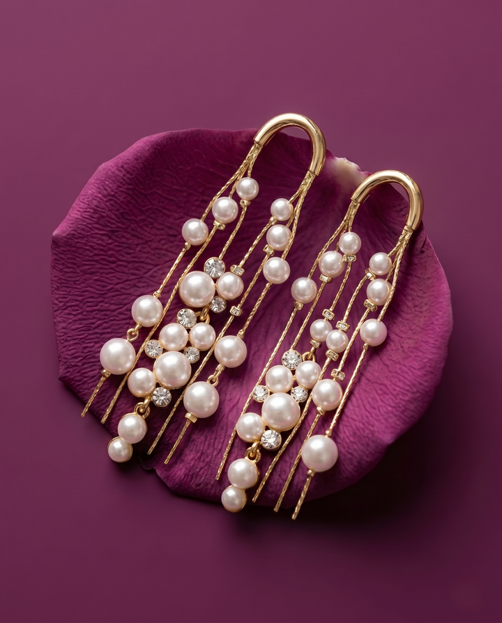 Pearl hair accessories with gold accents on a purple petal