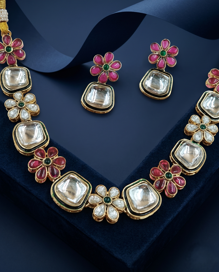 Jewelry set with necklace and earrings on a dark blue background