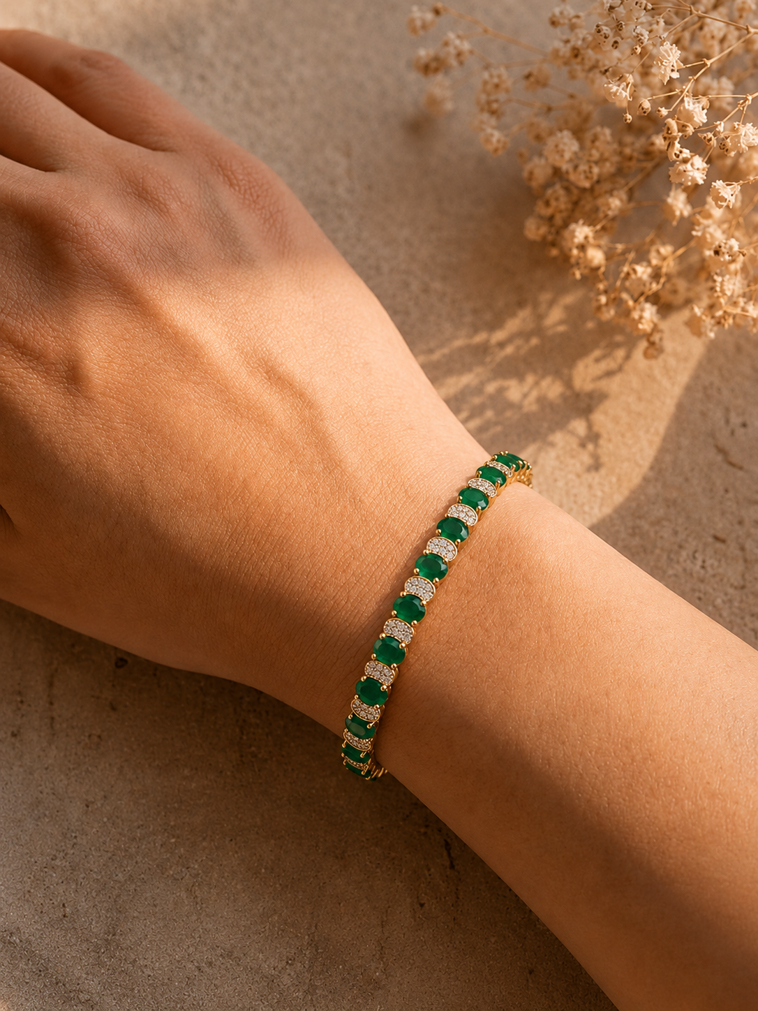 Shop the Emerald & Ruby in green and ruby stone. Crafted with  gold plating, sparkling CZ 