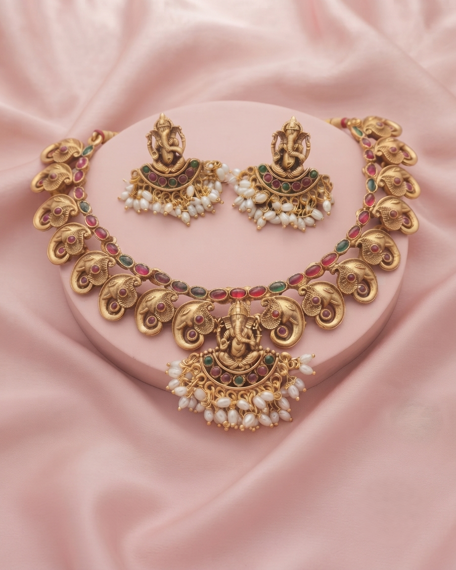 he matching Ganesha earrings complete this regal ensemble, making it an ideal accessory for brides, festive celebrations, religious ceremonies, and cultural events