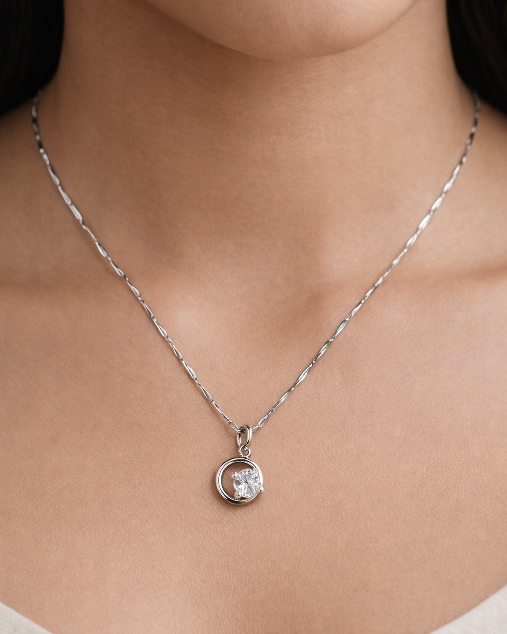 Silver-finish circular solitaire pendant necklace designed for women