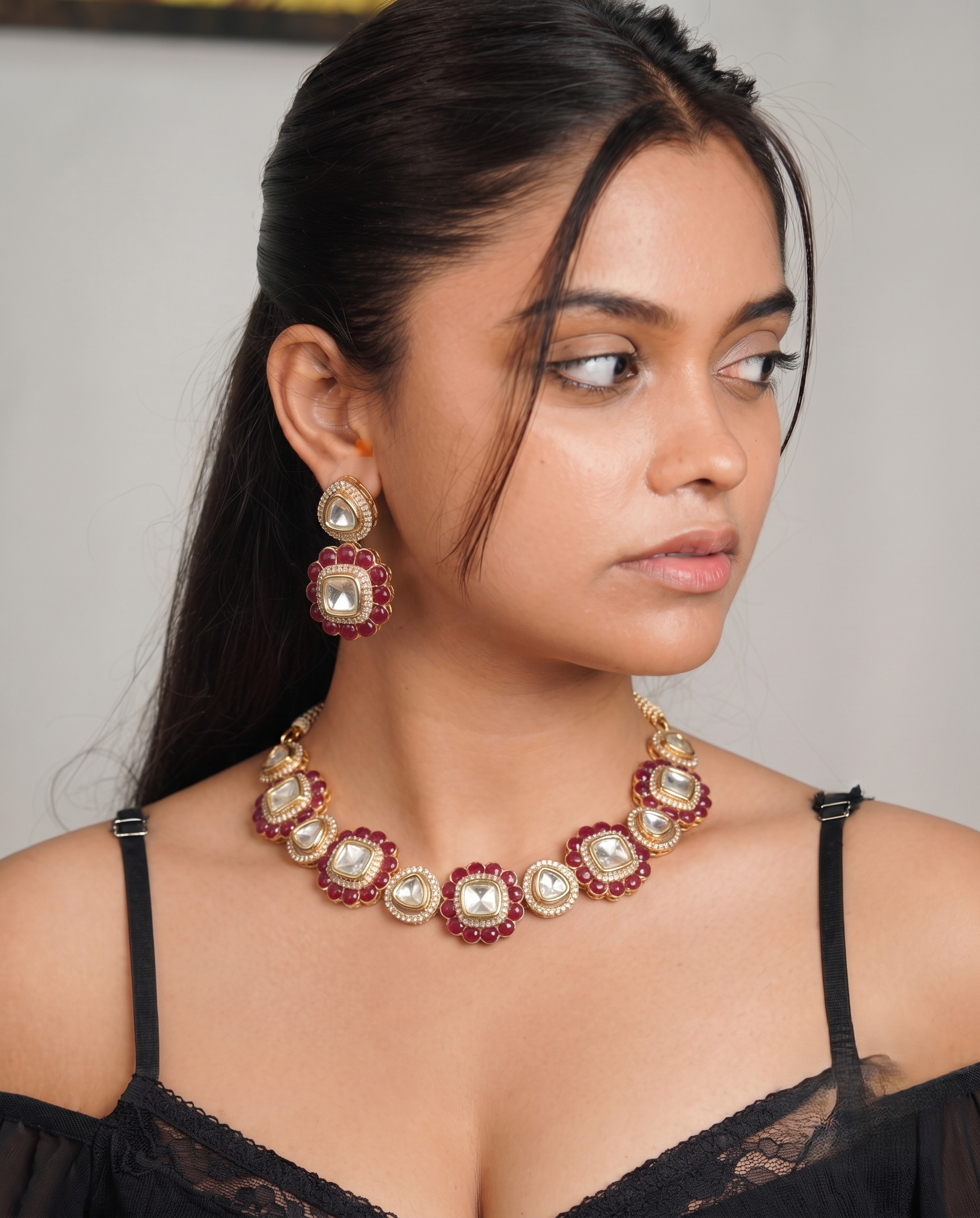 The intricate floral-inspired motifs and premium gold-tone finish make this jewellery set