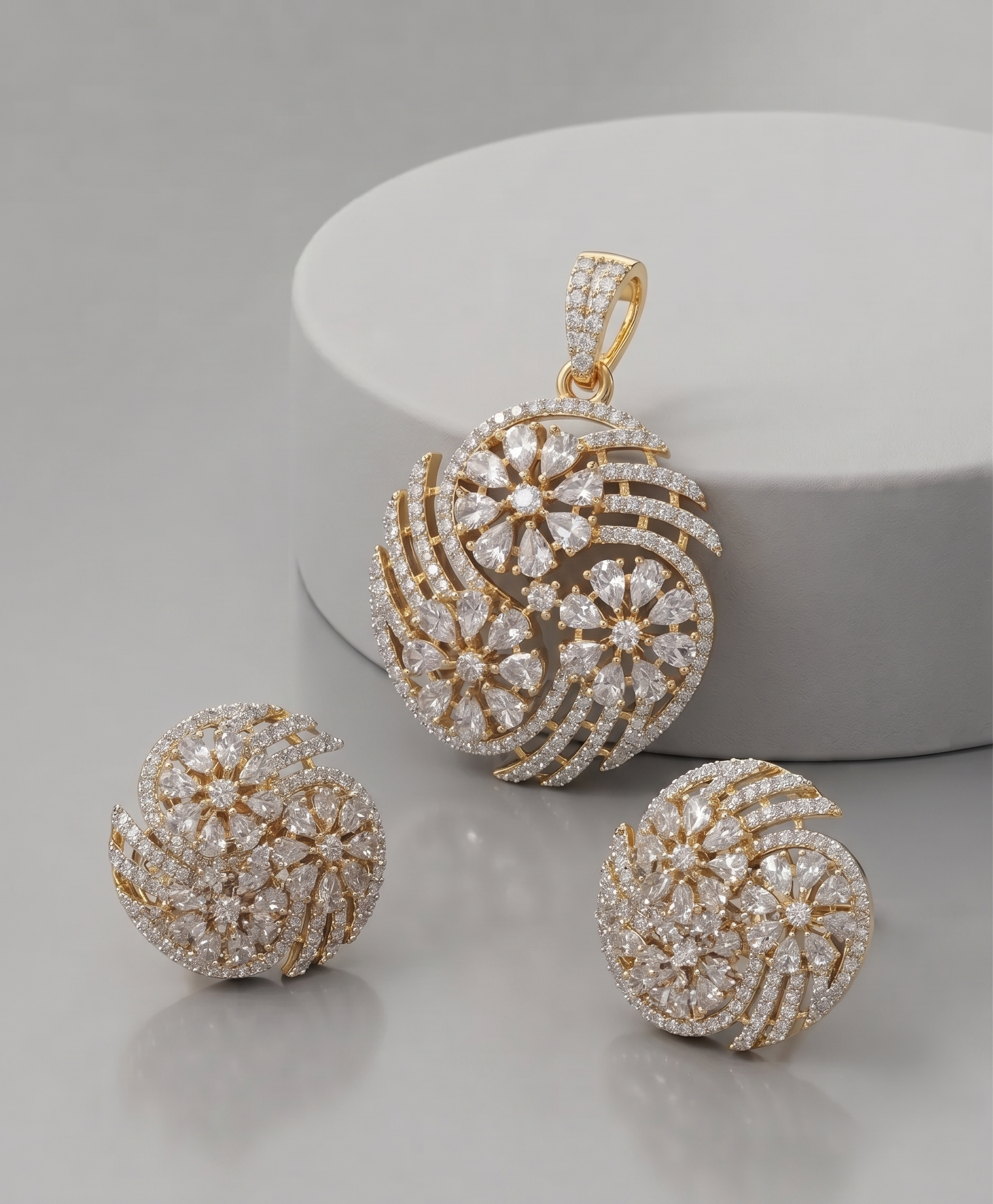 Premium gold-plated floral swirl pendant set featuring dazzling CZ stones and matching earrings 