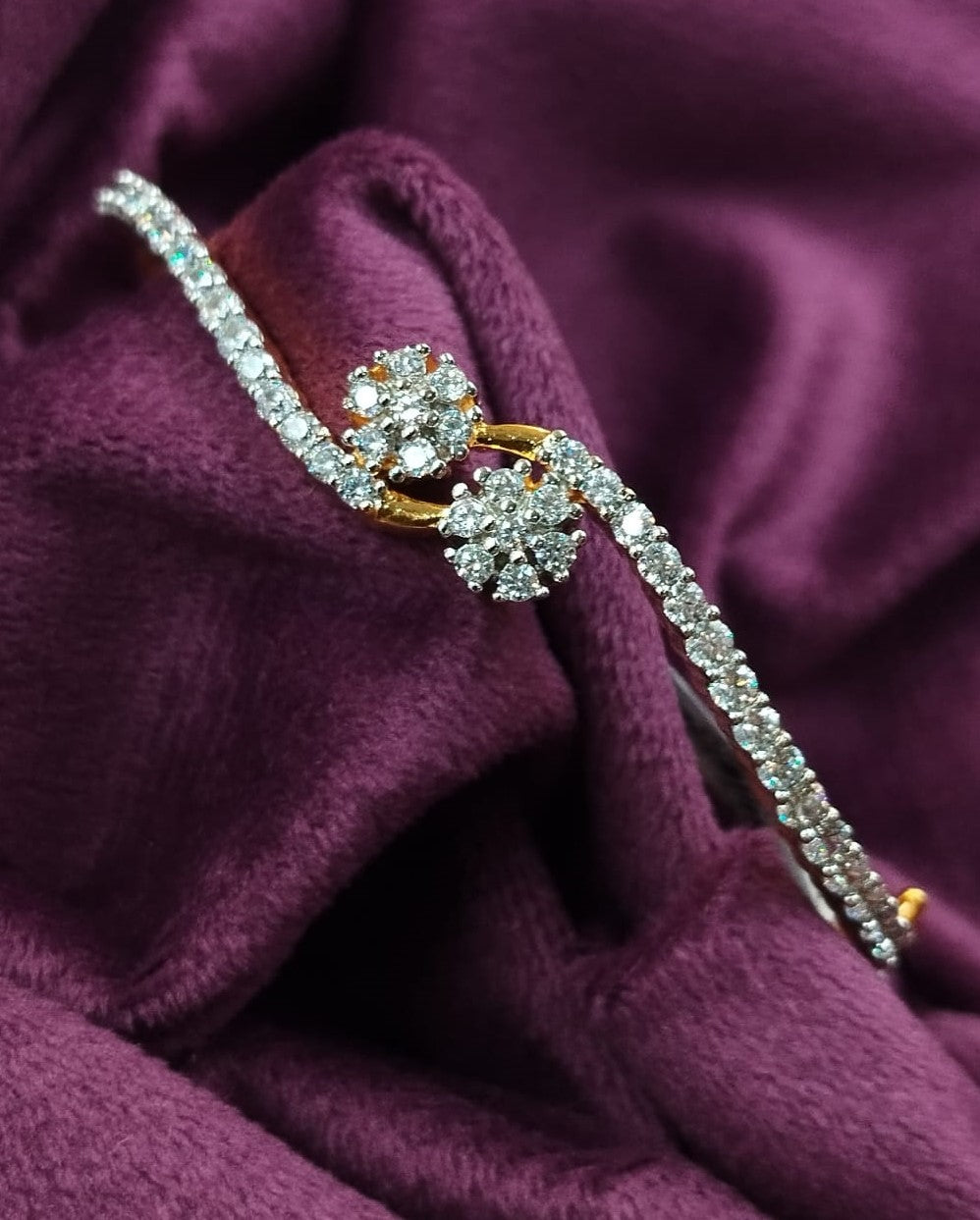 Diamond brooch on a purple fabric background