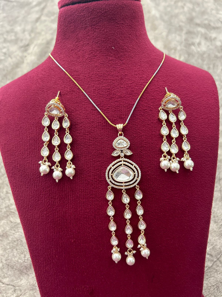 Jewelry set with necklace and earrings on a mannequin bust.