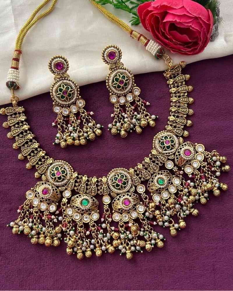 Traditional Gold Finish Temple Necklace Set with Green Enamel, Pink Stones & Pearl Drops