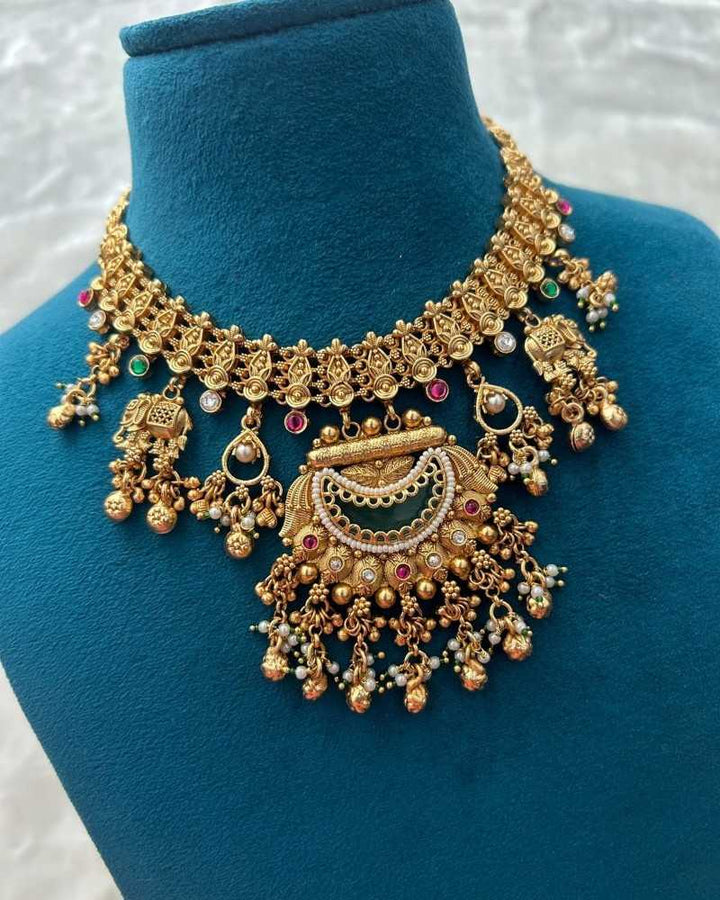 Traditional Gold Finish Temple Necklace Set with Green Enamel & Dangling Earrings