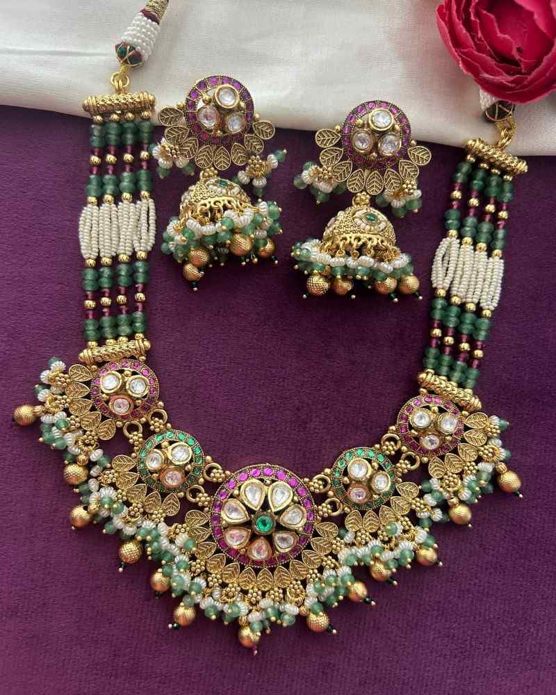 Traditional Gold Finish Pearl Antique Necklace Set with Green Beads, Kundan Work & Pink Stones