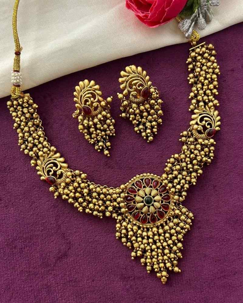 Antique Gold Ghunghroo Beaded Necklace Set with Floral Pendant and Matching Earrings