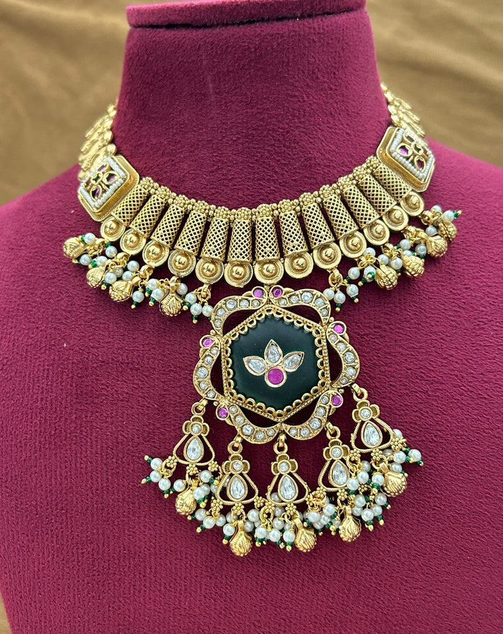 Premium Antique Finish Gold Plated Statement Necklace Set with Green Center Pendant and Ruby Detailing