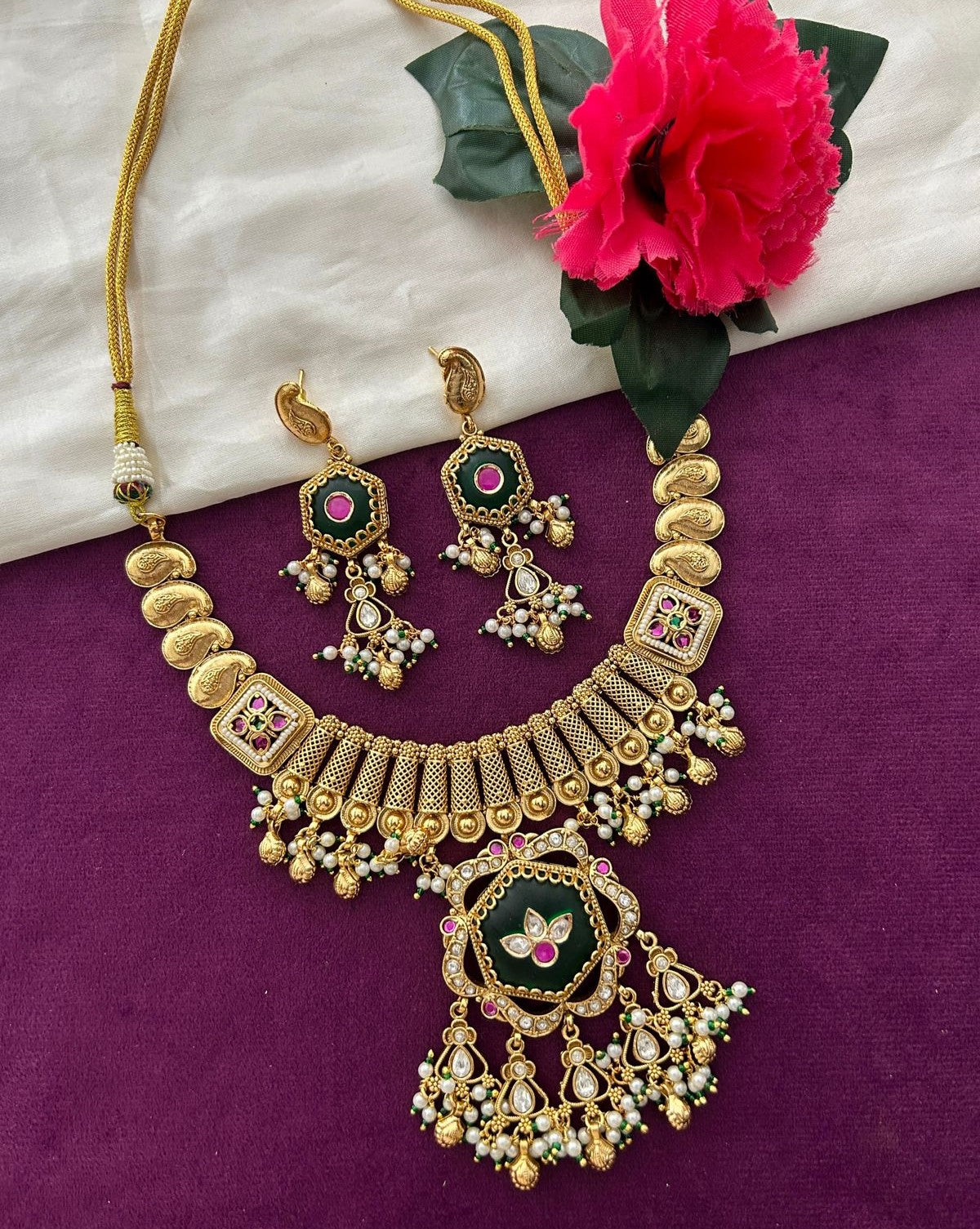Premium Antique Finish Gold Plated Statement Necklace Set with Green Center Pendant and Ruby Detailing