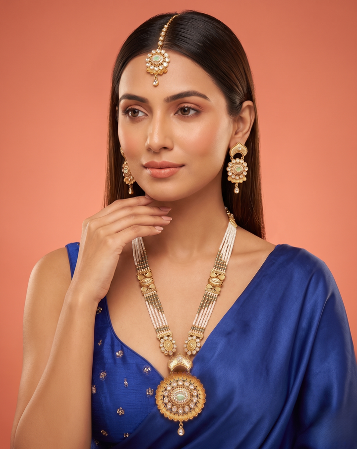 White Beaded Kundan Necklace Set with Mint Green Stone Pendant, Earrings and Maang Tikka
