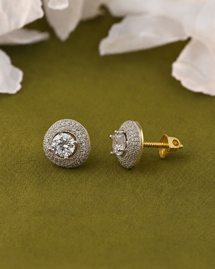 central clear gemstone surrounded by pavé-set silver-toned stones