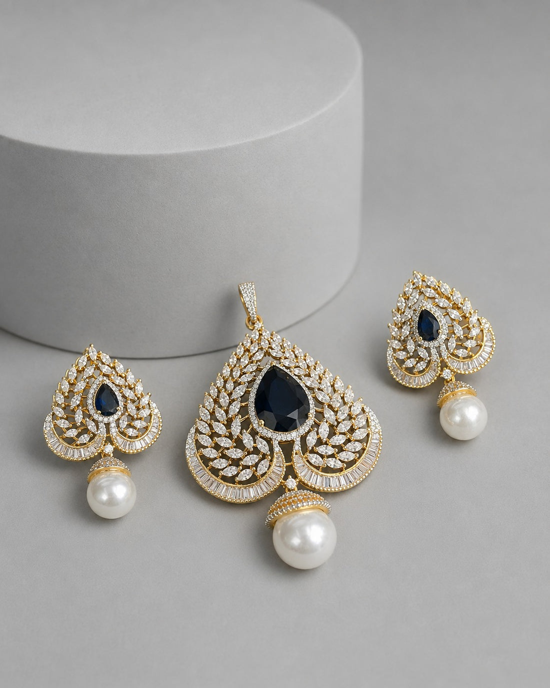 eardrop-shaped jewelry set with blue  teardrop gemstones, pavé-set clear crystals,