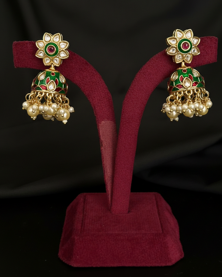 Pair of ornate earrings kundan