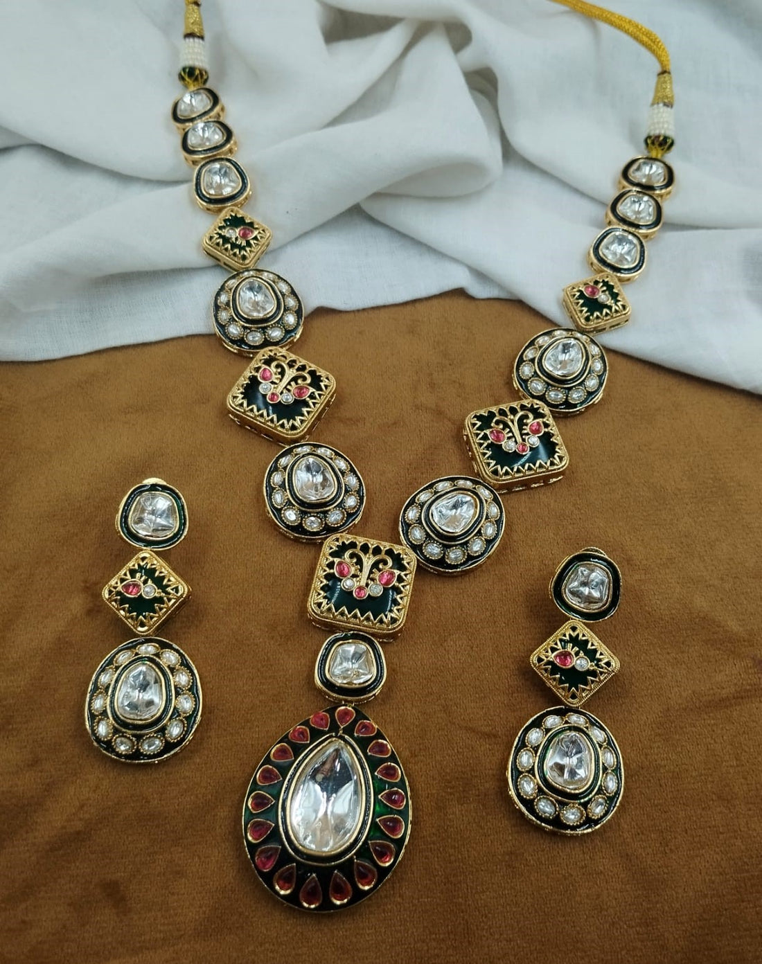 Traditional green meena kundan necklace featuring enamel detailing with matching earrings