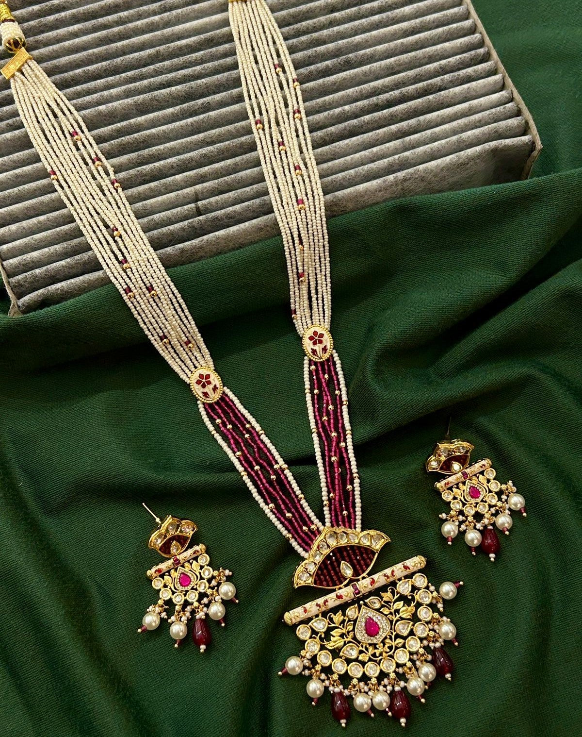 Elegant long necklace and earring set highlighted by refined kundan craftsmanship
